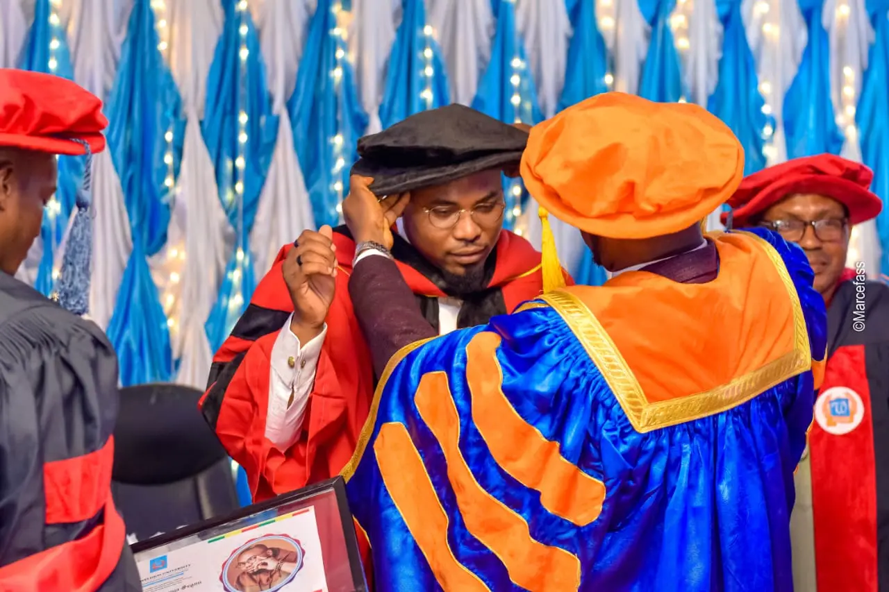 Academic hooding during an ISTAG graduation ceremony